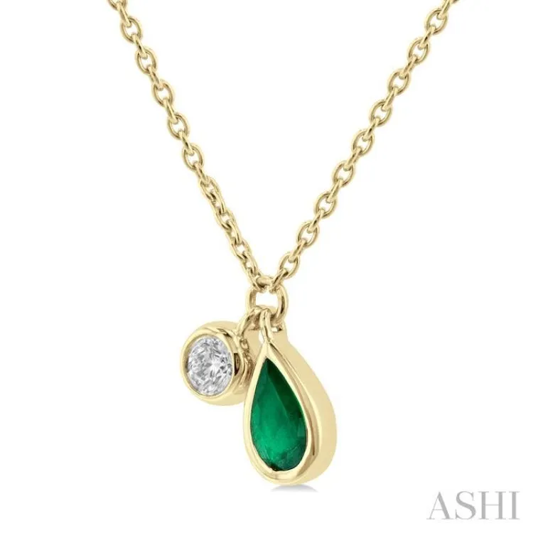 1/50 ctw Pear Cut 6X4MM Emerald and Bezel Set Round Cut Diamond Precious Necklace in 10K Yellow Gold