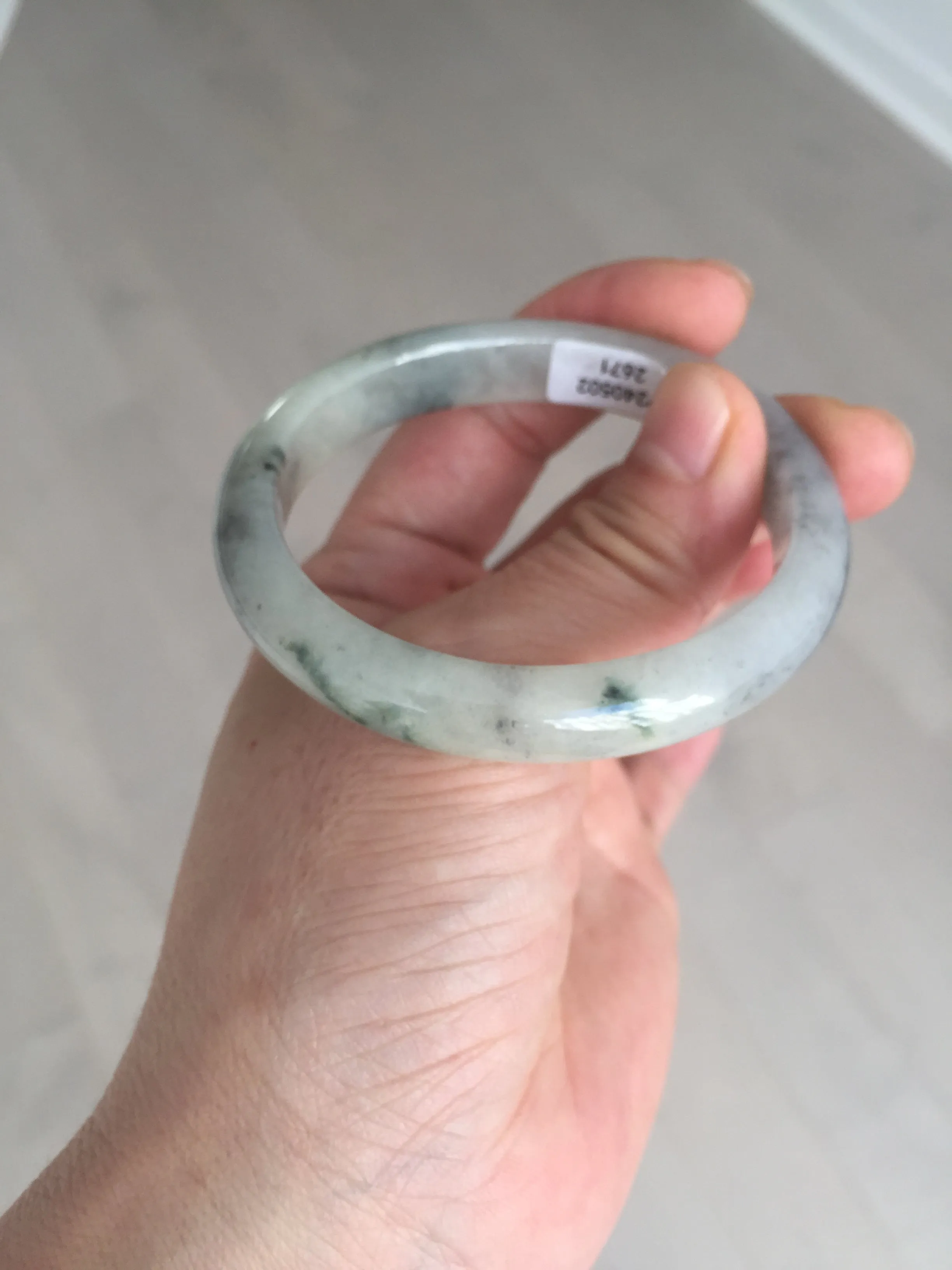 48mm Certified 100% natural Type A black/white(wuji) with flying green flowers oval jadeite jade bangle BP24-2671