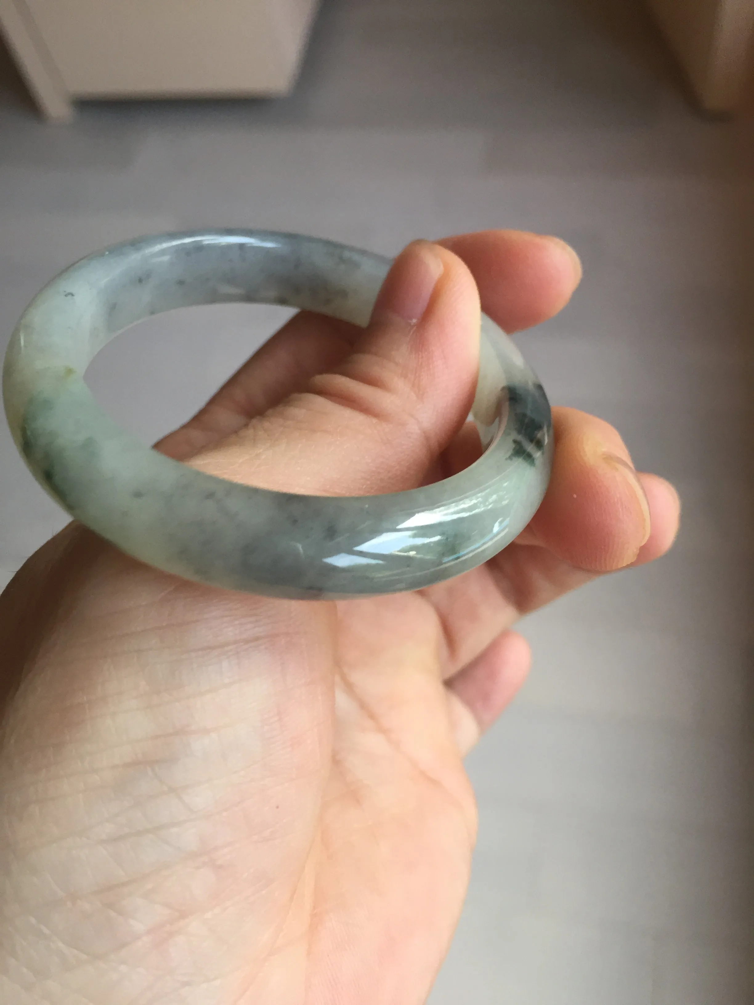 48mm Certified 100% natural Type A black/white(wuji) with flying green flowers oval jadeite jade bangle BP24-2671