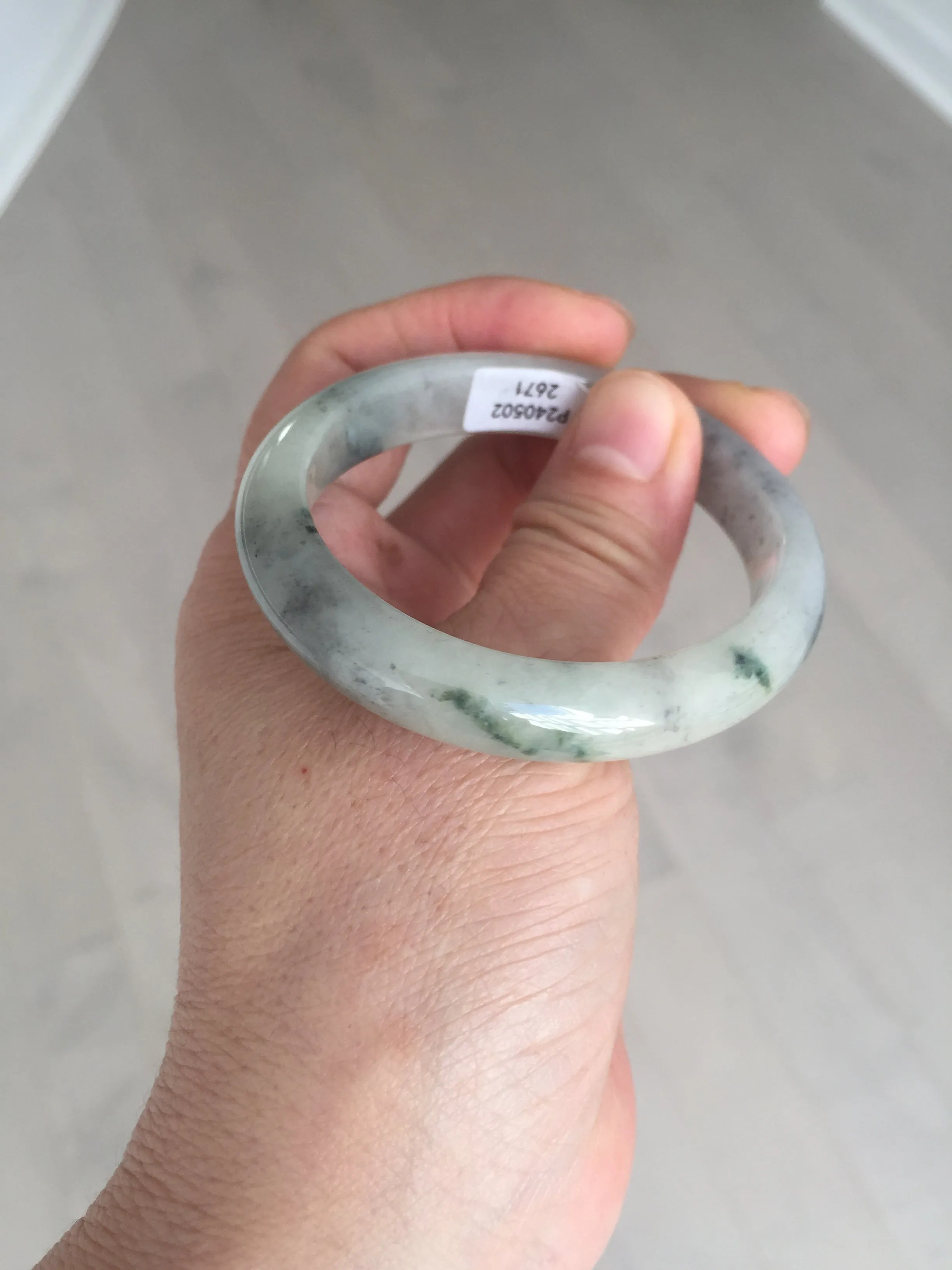 48mm Certified 100% natural Type A black/white(wuji) with flying green flowers oval jadeite jade bangle BP24-2671