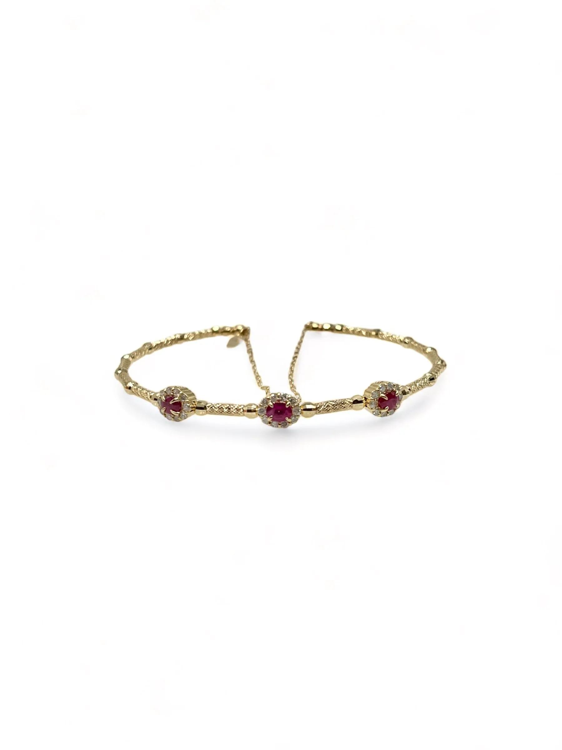 STRETCHABLE YELLOW GOLD OVAL RUBY BANGLE